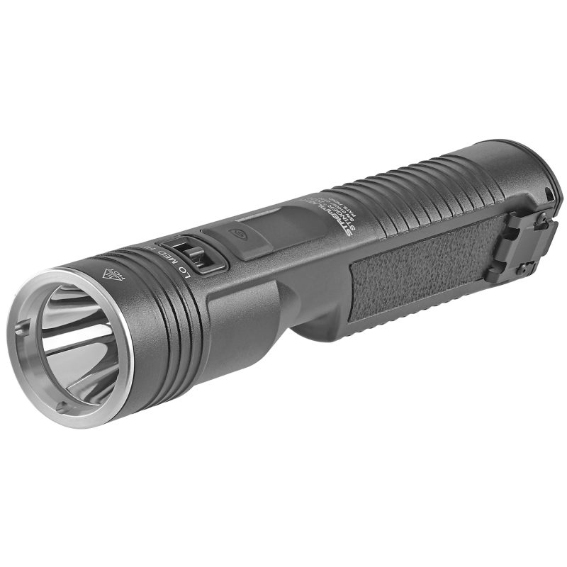 Black Streamlight Stinger 2020 flashlight with USB cord and battery pack on a rugged surface, ready for ranch work in the White Mountains.