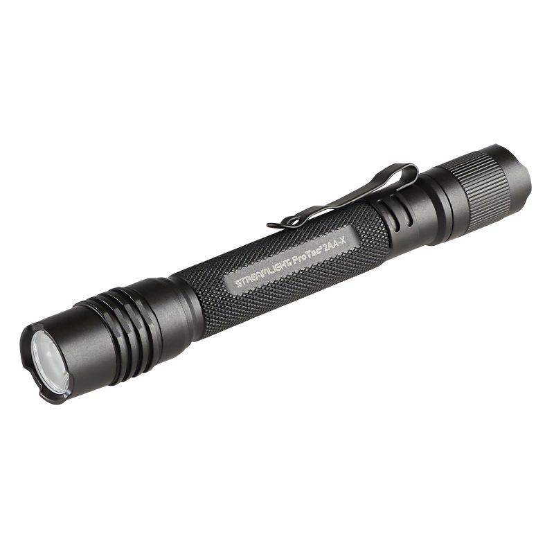 Black Streamlight ProTac 2AA-X USB tactical flashlight with included USB-C cable and nylon holster, shown on a rugged surface.