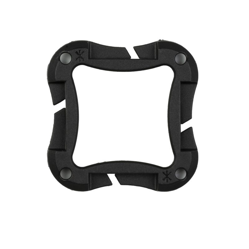 Black Unity Tactical Spark Cage, an all-polymer mount with internal magnets, shown securing a Spark marking light, ready for attachment to metal surfaces or webbing.