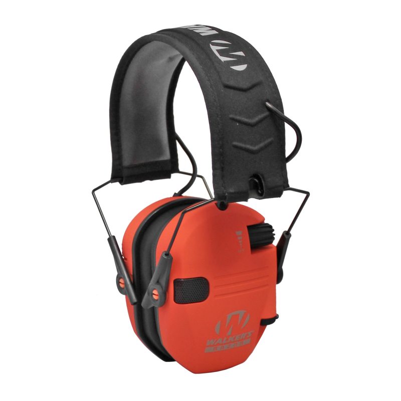 A pair of coral-colored Walker's Razor Slim Electronic Earmuffs with a padded headband, shown from a slight angle.