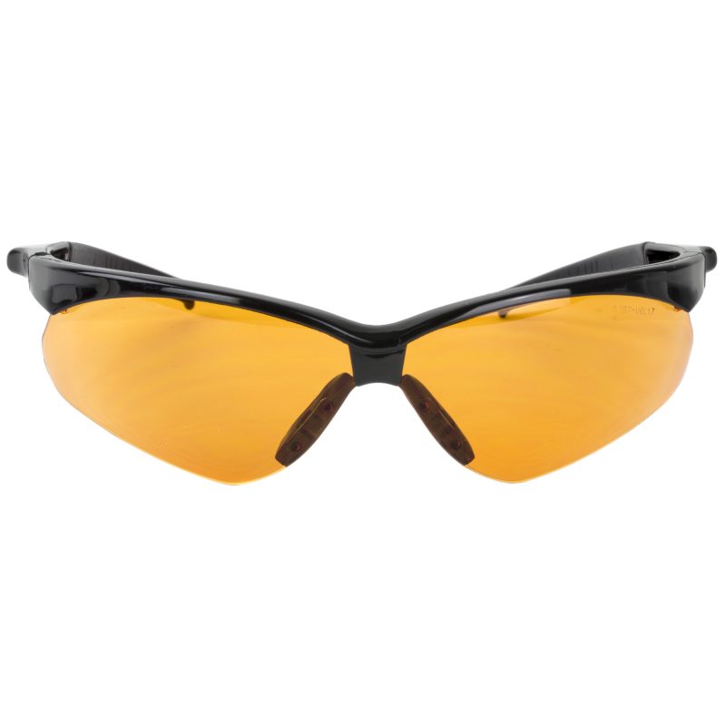 Pair of Walker's Crosshair Sport Glasses with amber polycarbonate lenses, shown against an outdoor, rugged background.